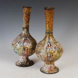 A pair of 19th century Indo-Persian enamel on copper bottle vases, decorated with oval and