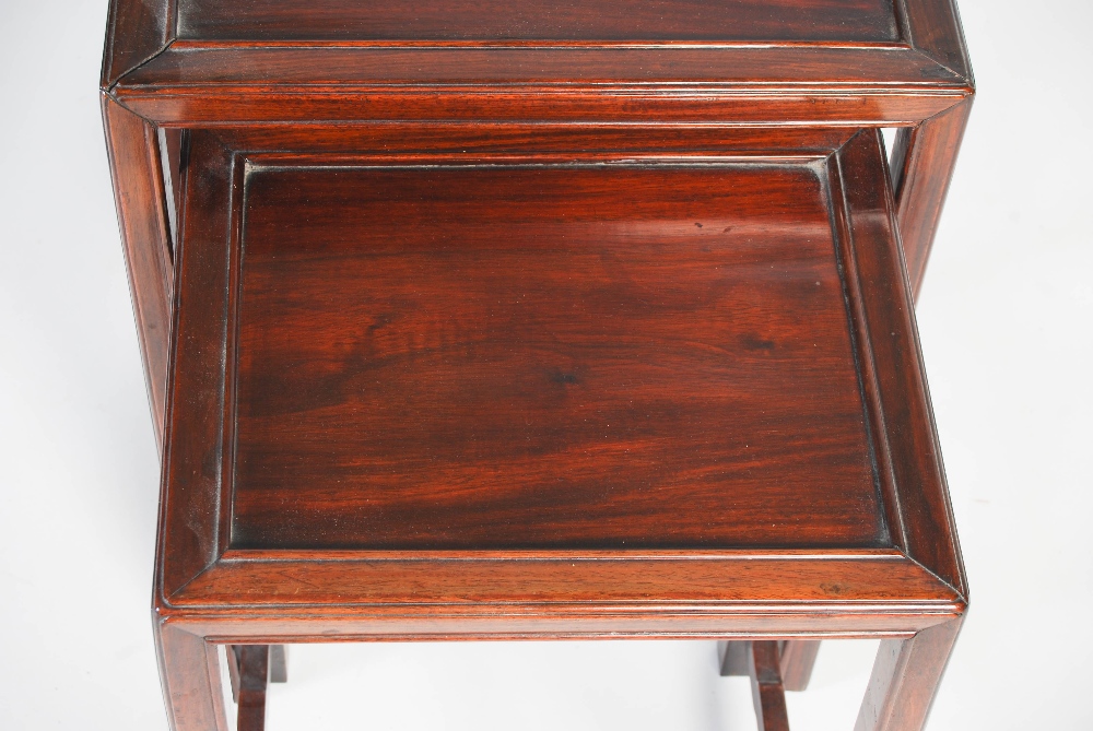 A nest of three Chinese dark wood occasional tables, late 19th/ early 20th century, the - Image 2 of 8