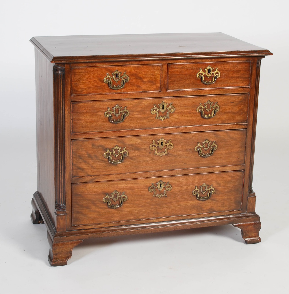 A late 19th/ early 20th century George III style chest, the rectangular top with moulded edge over