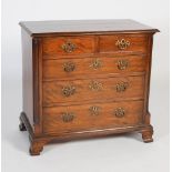 A late 19th/ early 20th century George III style chest, the rectangular top with moulded edge over