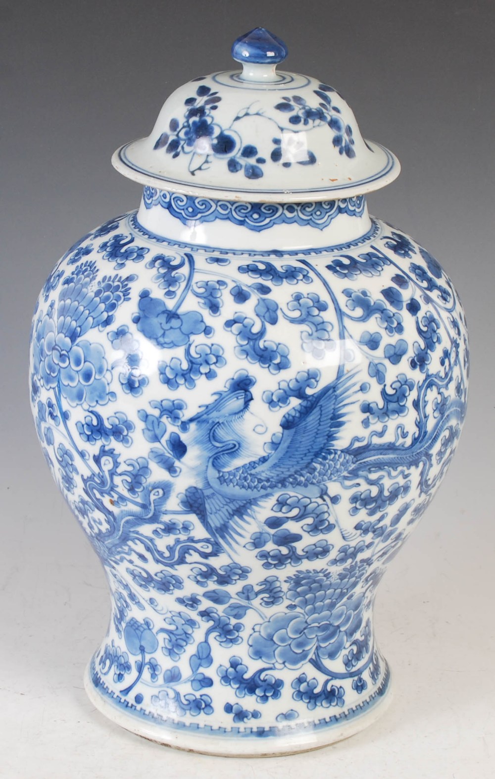 A Chinese porcelain blue and white jar and cover, Qing Dynasty, decorated with phoenix, peony and