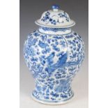A Chinese porcelain blue and white jar and cover, Qing Dynasty, decorated with phoenix, peony and