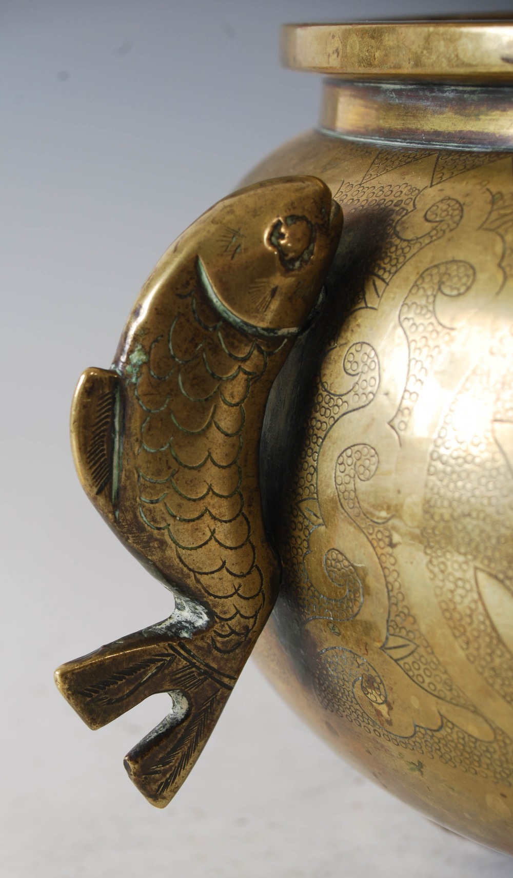 A Chinese bronze censer, of circular form, raised on three prong feet with applied fish shaped - Image 6 of 8