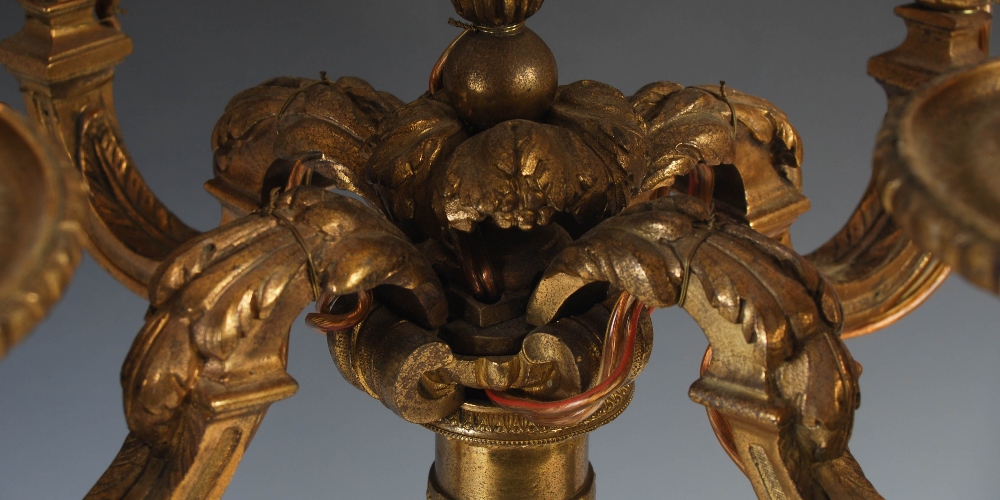 A pair of late 19th/ early 20th century gilt metal five light candelabras, with urn shaped nozzles - Image 5 of 5