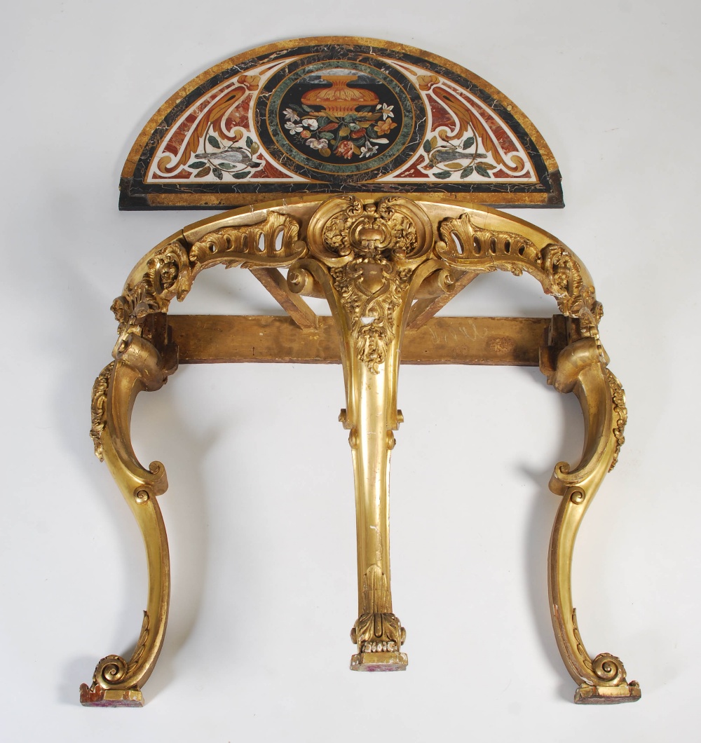 An Italian pietra dura and gilt wood demilune console table, the pietra dura top inlaid with various