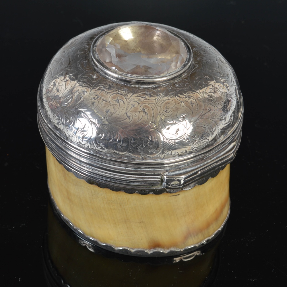 An early 19th century horn circular table snuff box, the domed silver cover profusely engraved - Image 2 of 3