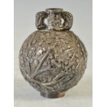 A late 19th century Chinese silver twin handled oviform vase, with embossed decoration of prunus,