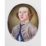 An oval enamel portrait miniature depicting an 18th century gentleman, 4.9cm x 3.7cm.