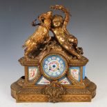 A late 19th century French gilt metal and porcelain mounted mantle clock, the circular blue ground