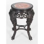 A Chinese darkwood jardiniere stand, Qing Dynasty, the circular top with marble insert above a