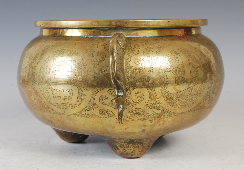 A Chinese bronze censer, of circular form, raised on three prong feet with applied fish shaped - Image 3 of 8