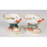 A pair of Berlin porcelain shell shaped salts, with painted decoration of birds and insects, blue