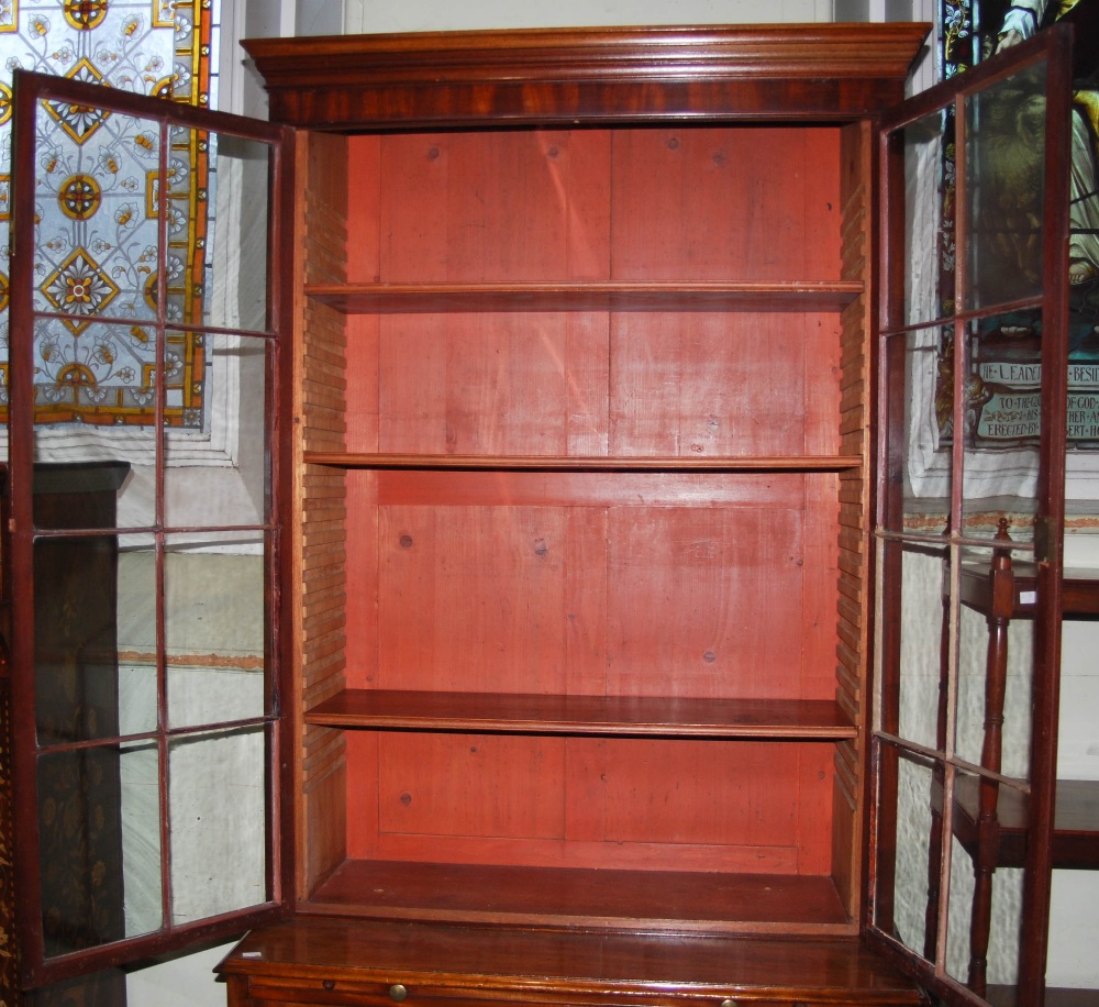 A 19th century mahogany bookcase, the moulded cornice above a pair of astragal glazed cupboard doors - Image 2 of 4