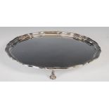 A George V silver salver, Birmingham, 1934, makers mark of Adie Brothers, of circular form with