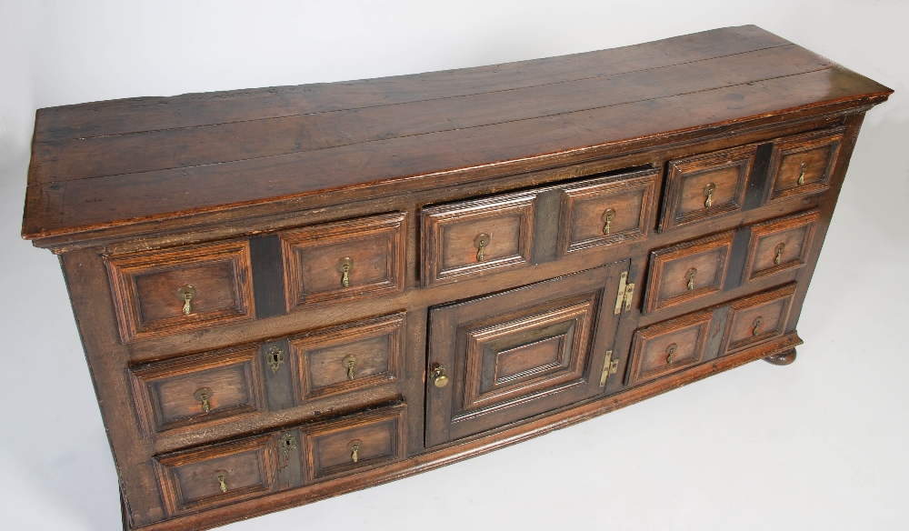 An 18th century oak dresser, the rectangular planked top above three frieze drawers and central - Image 2 of 9