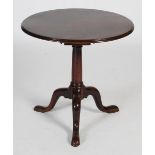 A George III mahogany snap-top occasional table, the hinged circular top with a moulded edge,