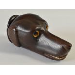 An unusual early 19th century wood snuff mull carved in the form of a dog's head, with inserted