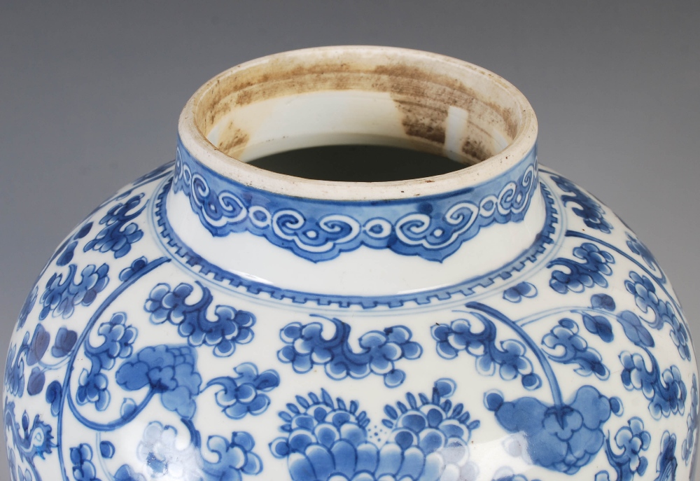 A Chinese porcelain blue and white jar and cover, Qing Dynasty, decorated with phoenix, peony and - Image 7 of 12