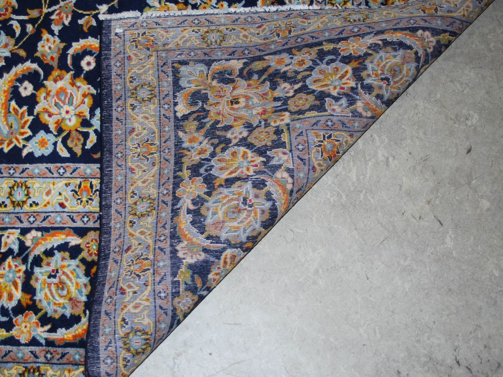 A Persian carpet, Isfahan, 20th century, the blue ground with all-over design of scrolling flowers - Image 3 of 8