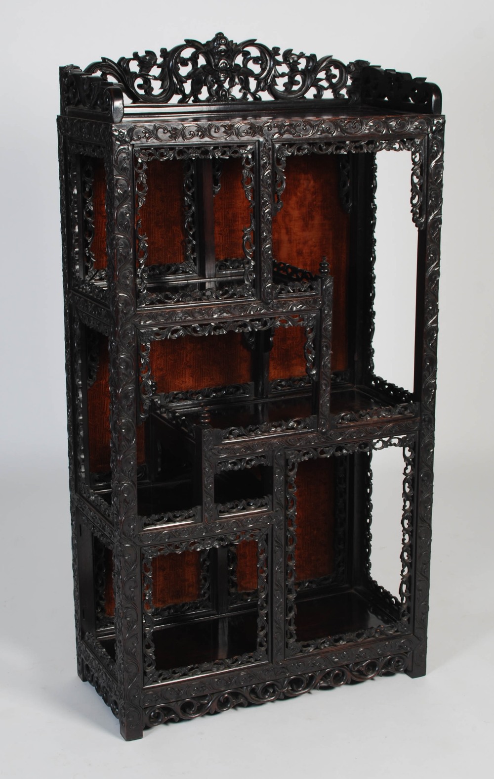 A Chinese darkwood display cabinet, late 19th/ early 20th century, the rectangular top with