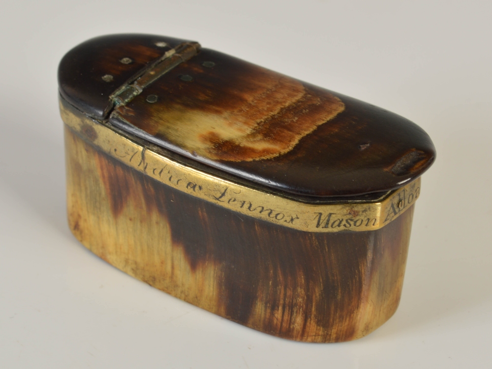 An early 19th century plain horn oblong cut-cornered snuff box, with brass mounts, the collar