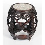 A Chinese darkwood and porcelain mounted barrel-shaped stool, Qing Dynasty, the circular top inset