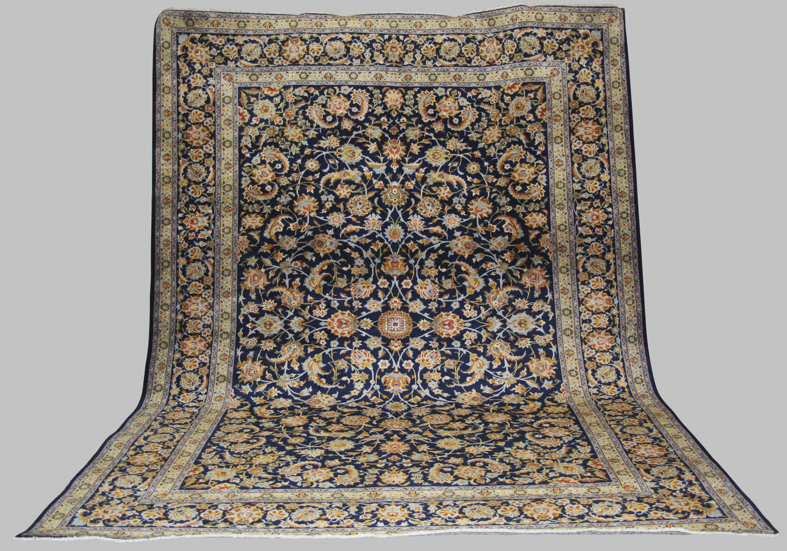 A Persian carpet, Isfahan, 20th century, the blue ground with all-over design of scrolling flowers