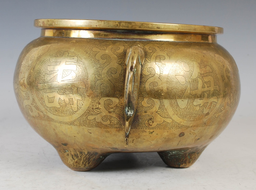 A Chinese bronze censer, of circular form, raised on three prong feet with applied fish shaped - Image 5 of 8