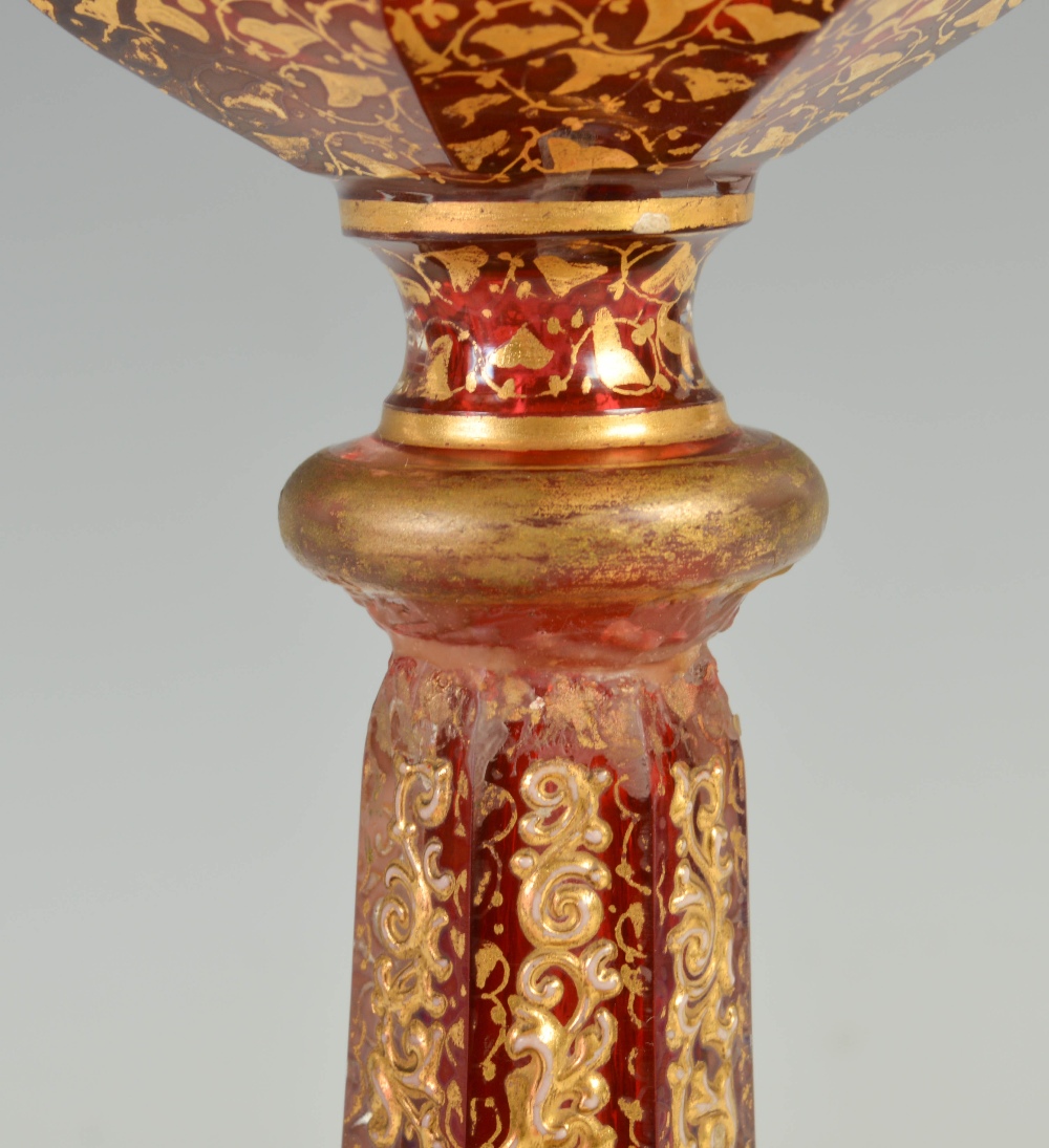 A late 19th century Bohemian ruby glass goblet, decorated in relief with panels of flowers and - Image 2 of 6