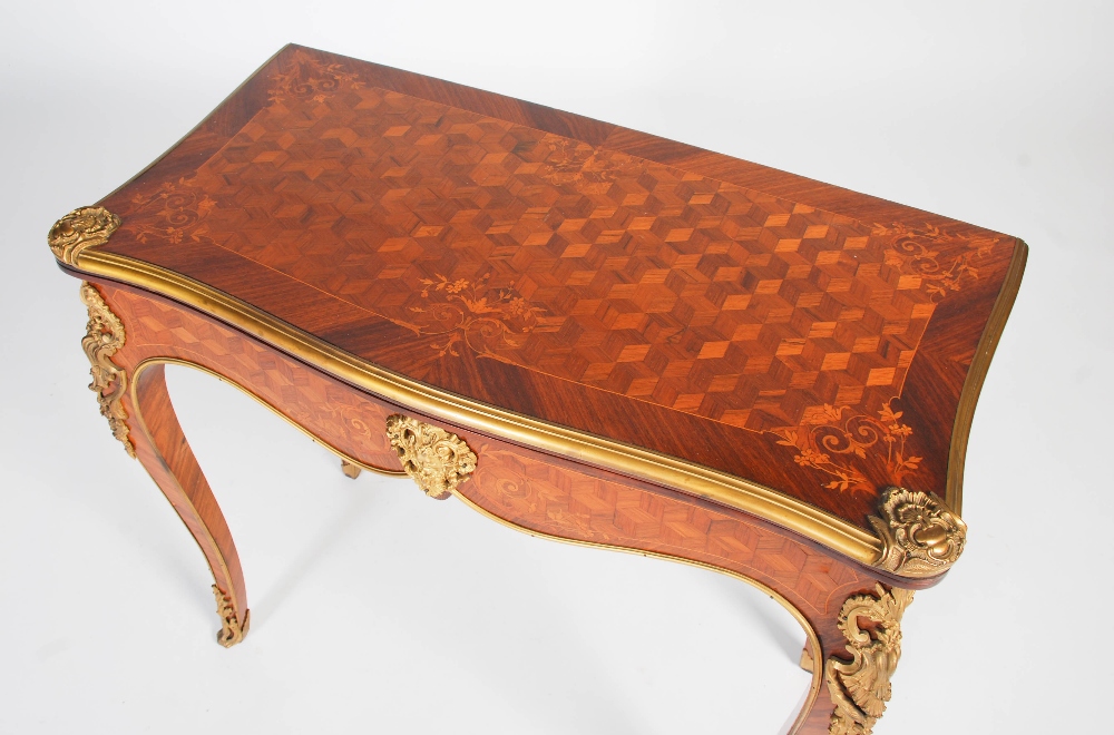 A late 19th/ early 20th century rosewood, parquetry and gilt metal mounted games/ card table, the - Image 2 of 7