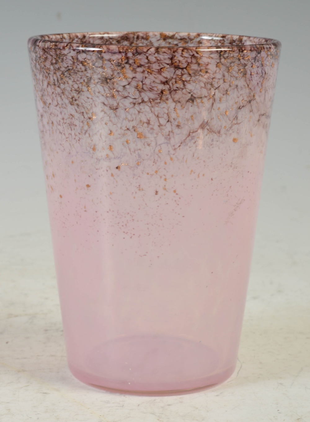 A small Monart vase, shape OE, mottled purple and pink with gold coloured inclusions, 14cm high.