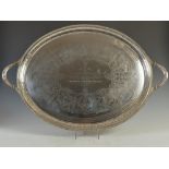 A Victorian twin handled oval shaped silver tray, London, 1877, makers mark of JB over EB,