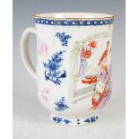 A Chinese porcelain blue and white tankard, Qing Dynasty, decorated in famille rose enamels with