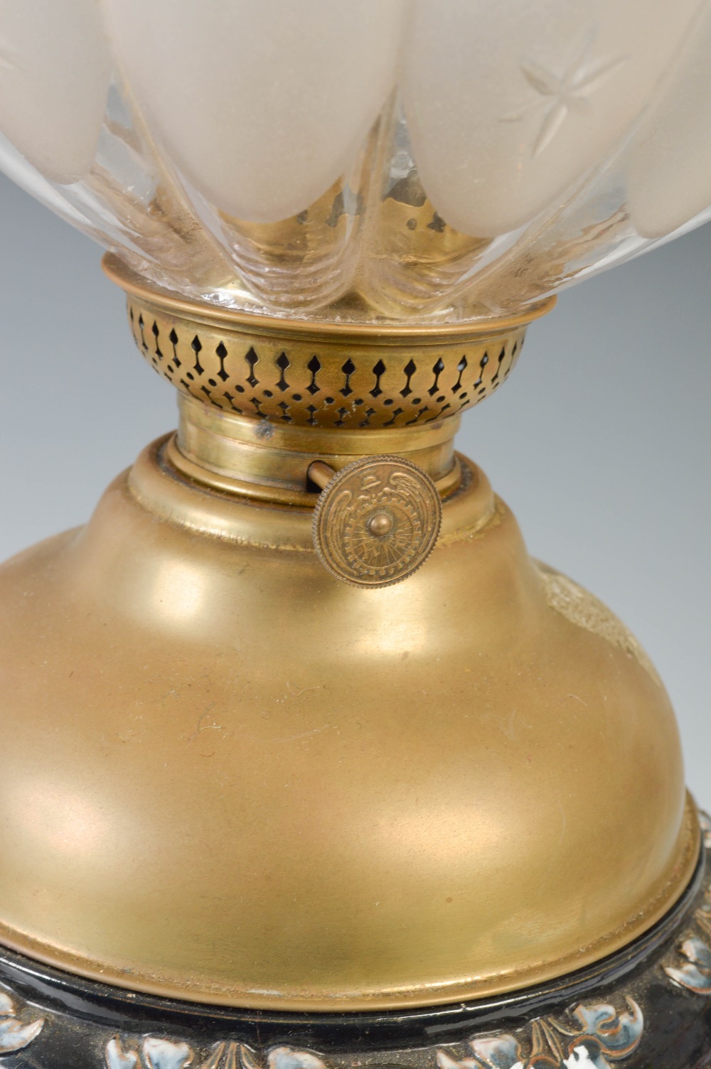 A late 19th/ early 20th century pottery oil lamp, the clear and frosted glass shade of lobbed form - Image 2 of 4