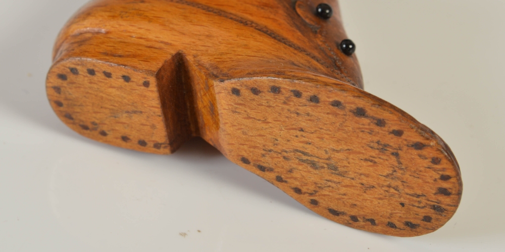 An early 19th century novelty treen snuff box carved in the form of a boot, with five stained - Image 3 of 3