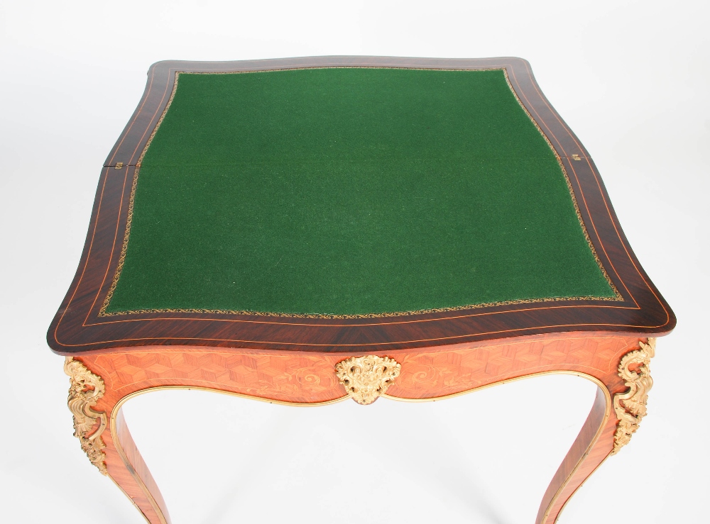 A late 19th/ early 20th century rosewood, parquetry and gilt metal mounted games/ card table, the - Image 6 of 7