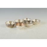 A set of six late 19th/ early 20th century Indian silver finger bowls, with embossed decoration of