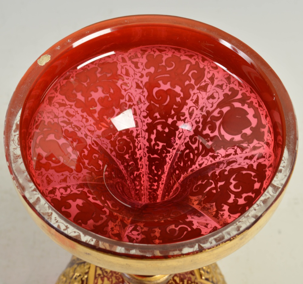 A late 19th century Bohemian ruby glass goblet, decorated in relief with panels of flowers and - Image 4 of 6