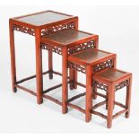 A quartetto of four Chinese darkwood and burr wood occasional tables, 20th century, the panelled