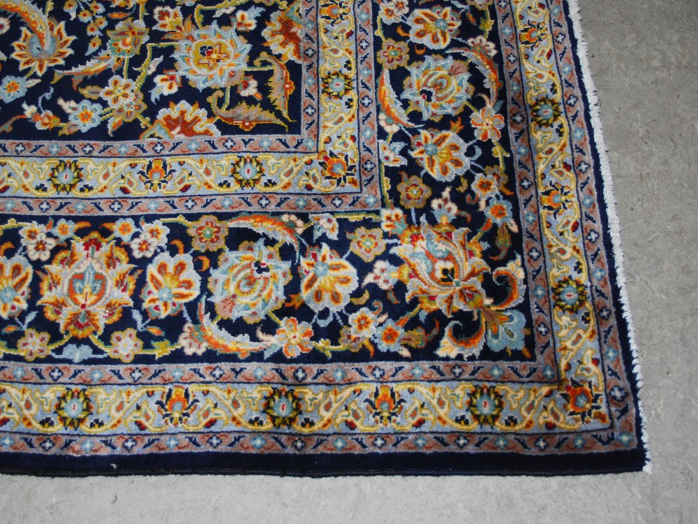 A Persian carpet, Isfahan, 20th century, the blue ground with all-over design of scrolling flowers - Image 2 of 8