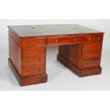 A 19th century mahogany partners desk, the rectangular top with green and gilt leather writing