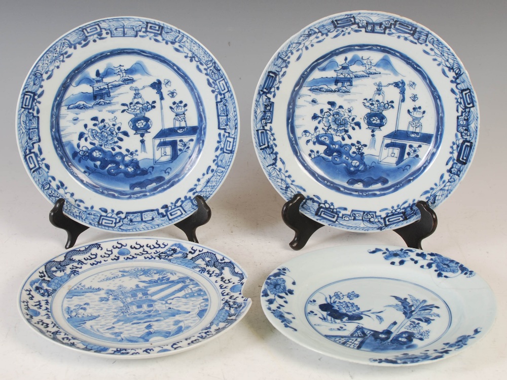 Four Chinese blue and white porcelain plates, Qing Dynasty, comprising; a pair of plates decorated