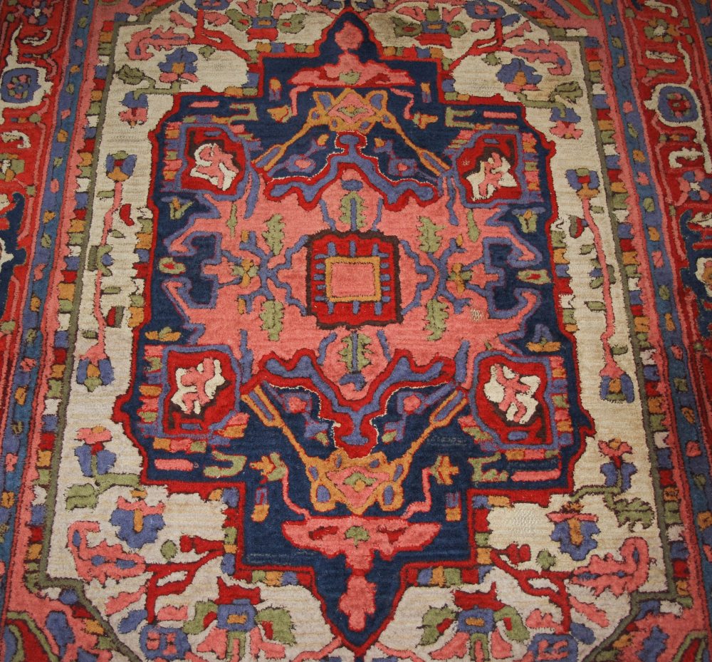 A Persian rug, 20th century, the rectangular field centred with a blue ground medallion within a - Image 4 of 6