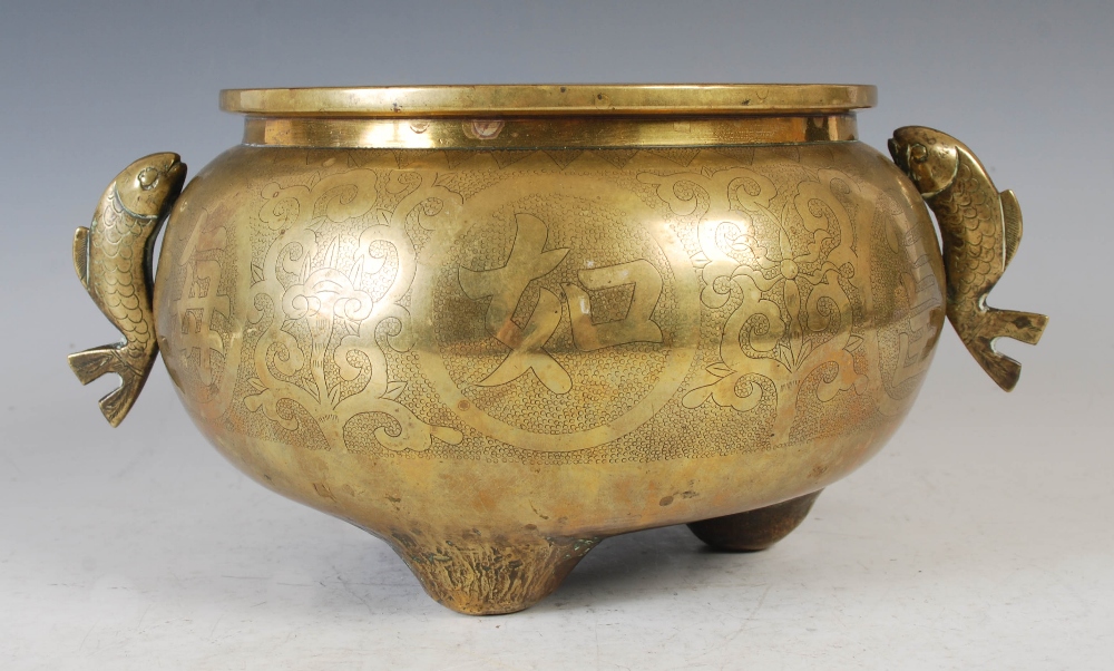 A Chinese bronze censer, of circular form, raised on three prong feet with applied fish shaped - Image 2 of 8