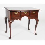 A late 18th/ 19th century mahogany lowboy, possibly American, the rectangular top with moulded