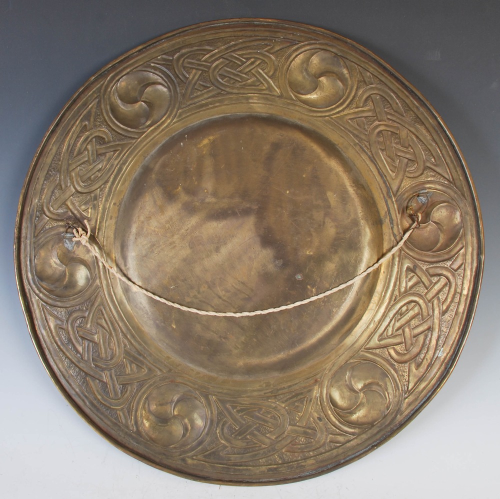 An early 20th century Scottish Arts and Crafts brass charger, with embossed decoration of six - Image 3 of 3