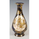 A Japanese Satsuma pottery blue ground pear-shaped vase, Meiji Period, finely decorated with two