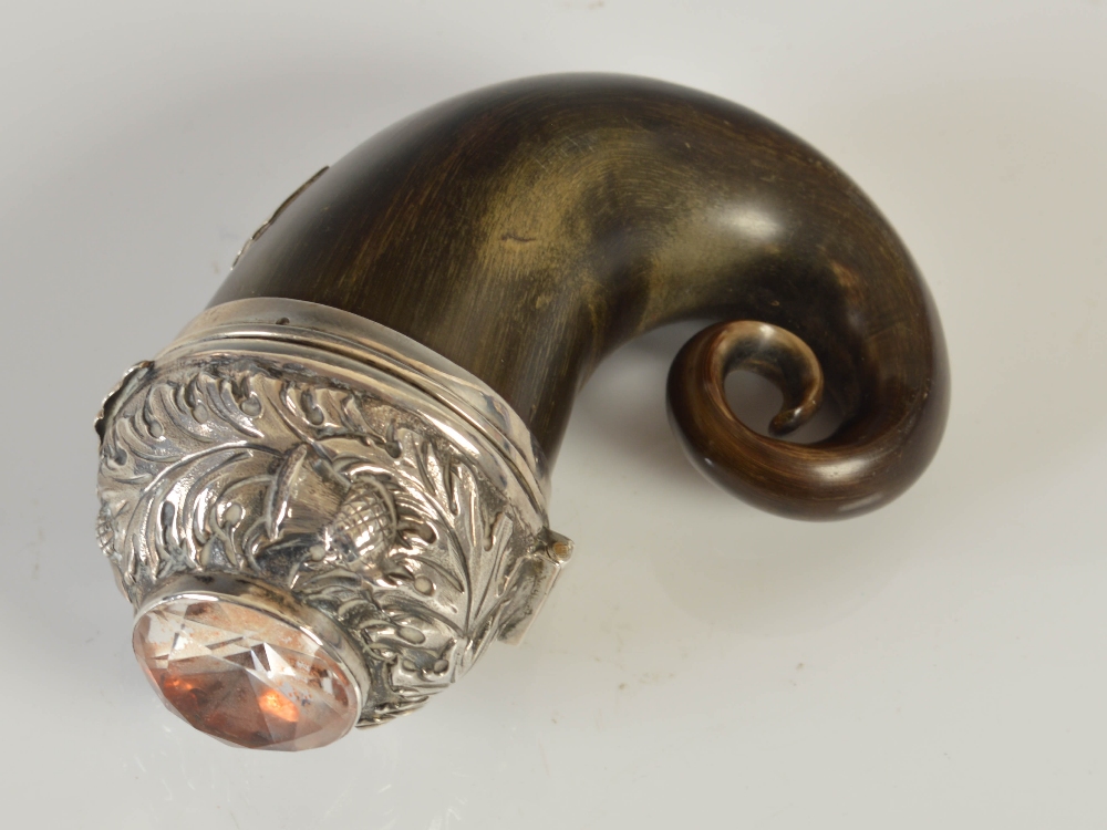 A mid 19th century curly horn snuff mull with silver mounts, embossed with thistles and set with a