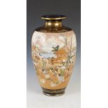 A large Japanese Satsuma pottery blue ground vase, Meiji Period, decorated with panels of figures,
