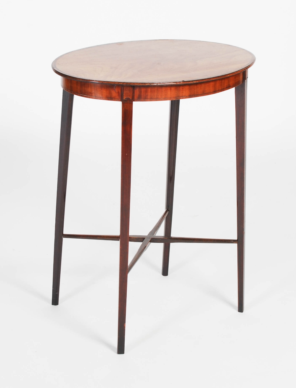 A 19th century mahogany occasional table, the oval-shaped top with boxwood lined and rosewood banded